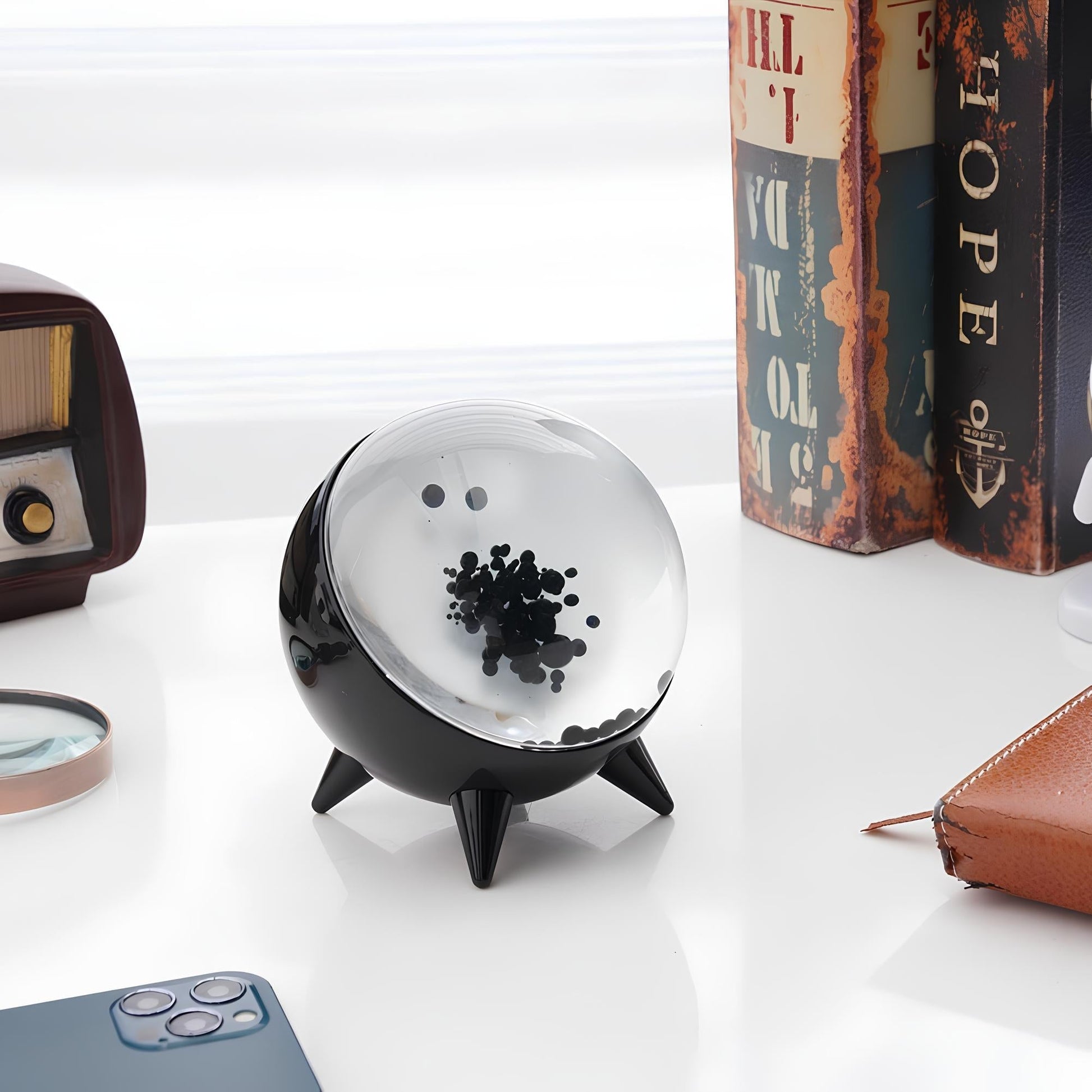 "Music-reactive ferrofluid display with black fluid art in motion, Bluetooth connectivity, and built-in lighting for tech lov