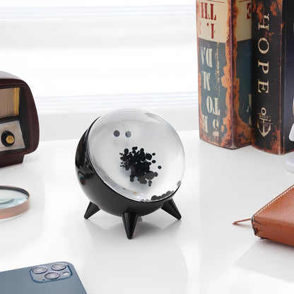 "Music-reactive ferrofluid display with black fluid art in motion, Bluetooth connectivity, and built-in lighting for tech lov