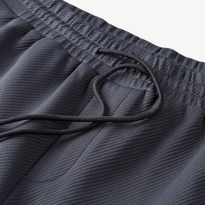 "Navy and black men's tracksuit set with zip jacket and joggers, showcasing sleek design and comfort for casual or gym wear."