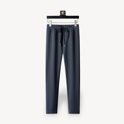 "Navy and black men's tracksuit set with zip jacket and joggers, showcasing sleek design and comfort for casual or gym wear."