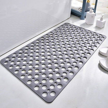 Non-slip shower mat with suction cups, textured for comfort, mold-resistant, in blue, green, grey; enhances bathroom safety.