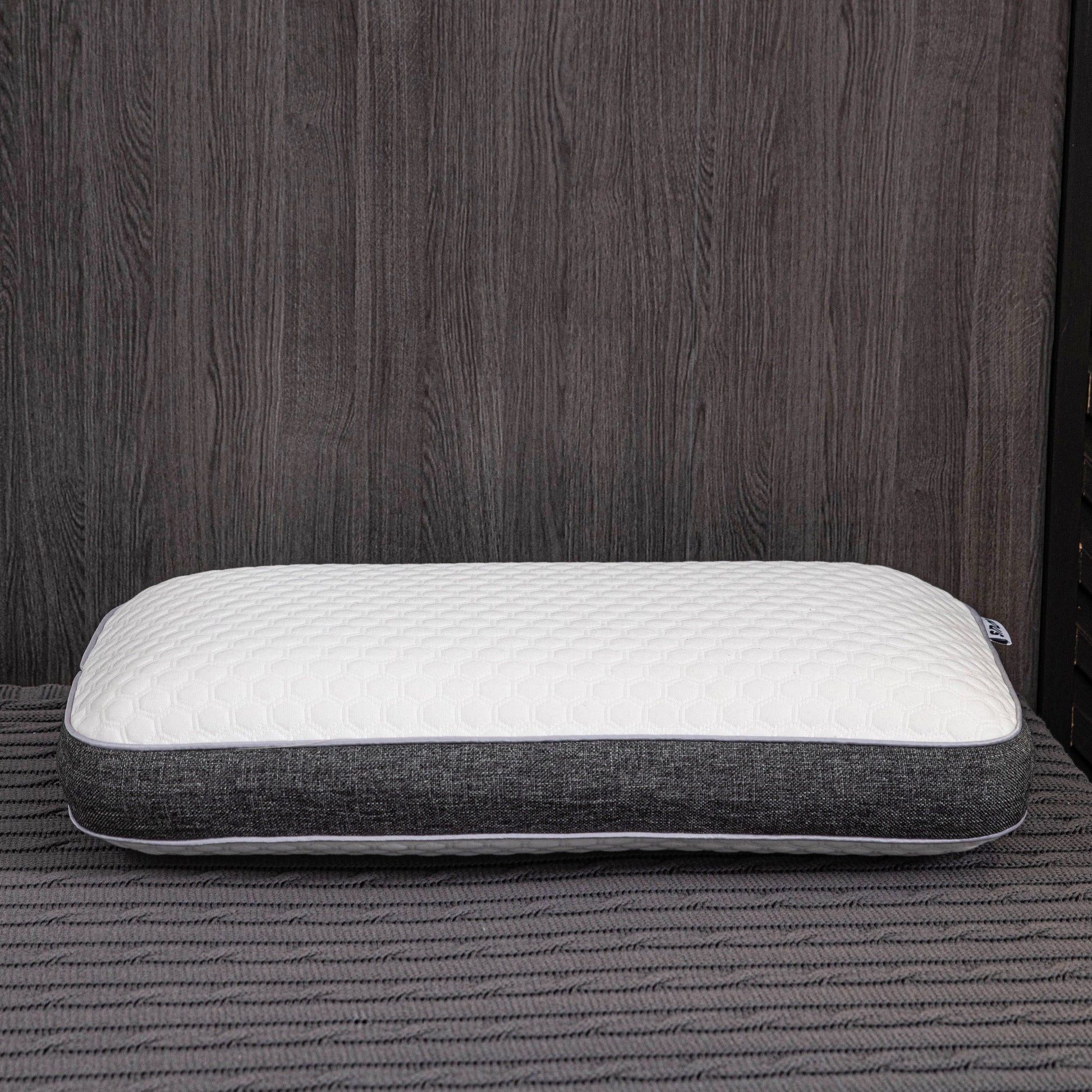Orthopedic memory foam pillow offering pain-free sleep with ergonomic design and breathable cover for all sleep positions.