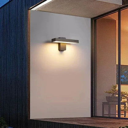 "Outdoor PIR motion sensor wall light, black aluminium, IP65 waterproof, rotatable design, warm white glow, modern style."