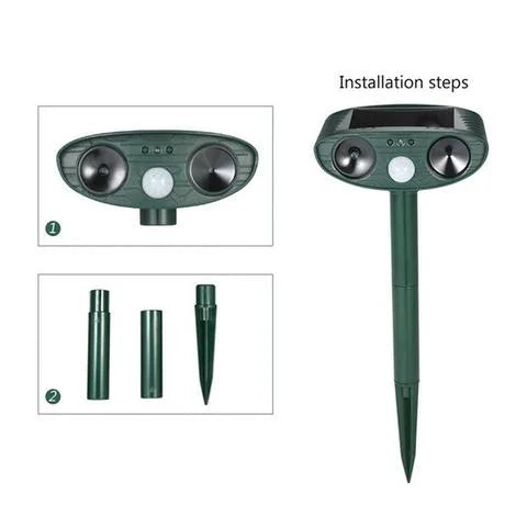 "Outdoor solar-powered ultrasonic deer repeller in garden setting, showcasing green and grey weather-resistant design."