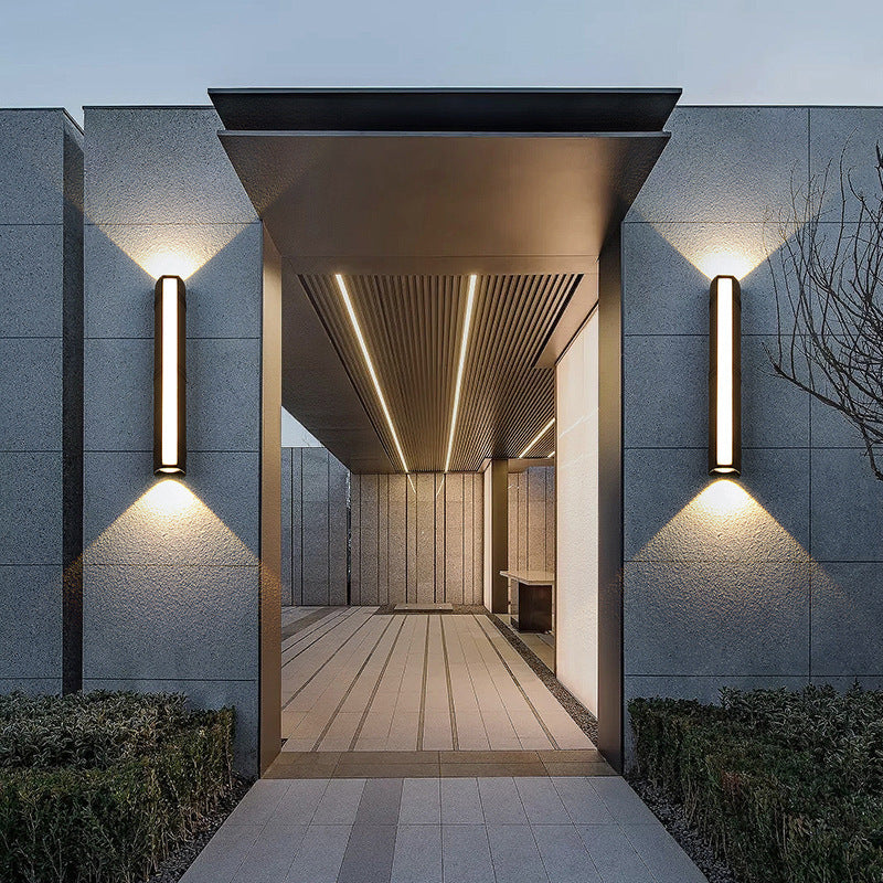 Outdoor wall light with LED technology, rustproof aluminum, sleek design, waterproof, ideal for garden or patio lighting.