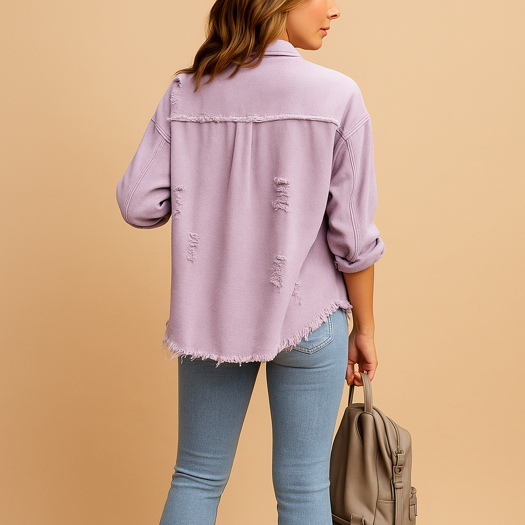 Oversized distressed denim jacket for women with soft-touch fabric and long sleeves, ideal for casual or elevated outfits.