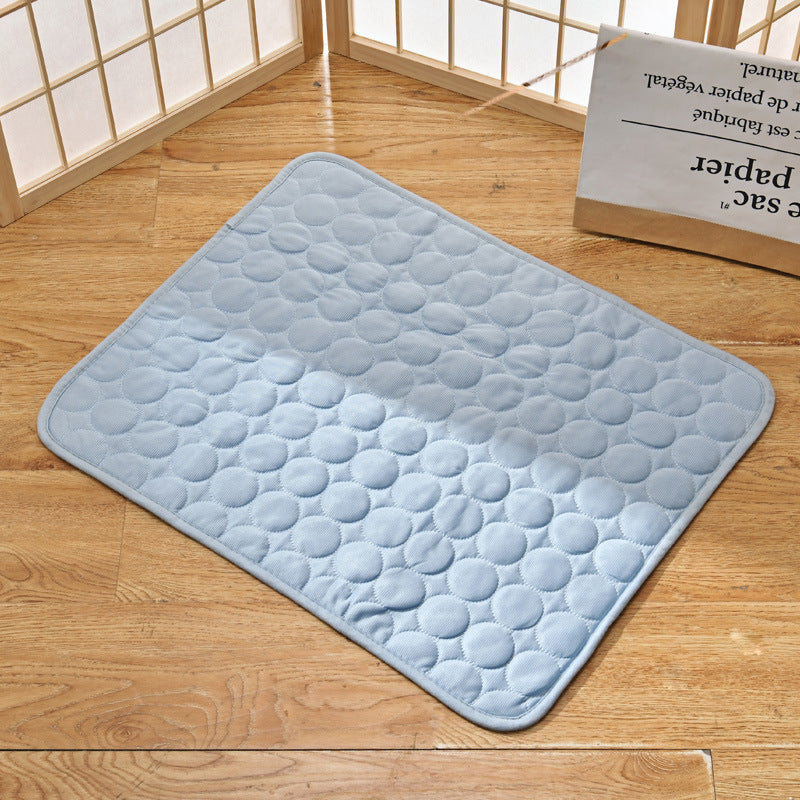 "Pet cooling pad in light blue, ideal for summer. Features breathable, machine-washable fabric, available in multiple sizes."