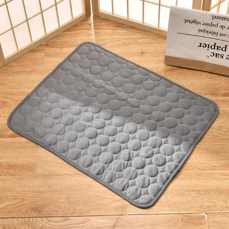 "Pet cooling pad in light blue, ideal for summer. Features breathable, machine-washable fabric, available in multiple sizes."