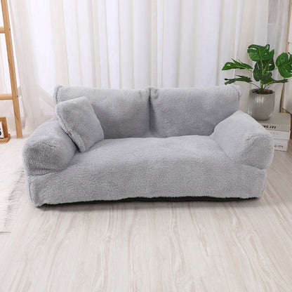 "Plush dog sofa bed in beige, features raised edges for security, soft cushioning for comfort, available in versatile sizes."