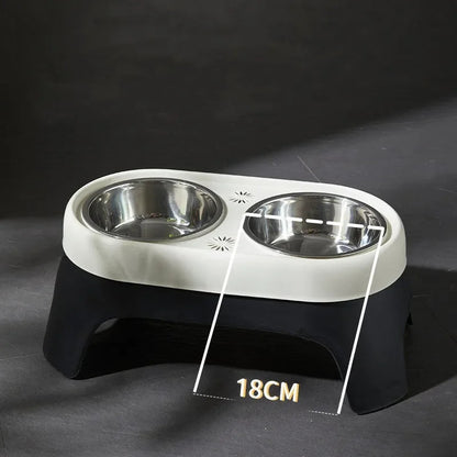 "Raised dog feeding station with sleek stainless steel bowls on a stable, non-slip base for mess-free, stylish dining."
