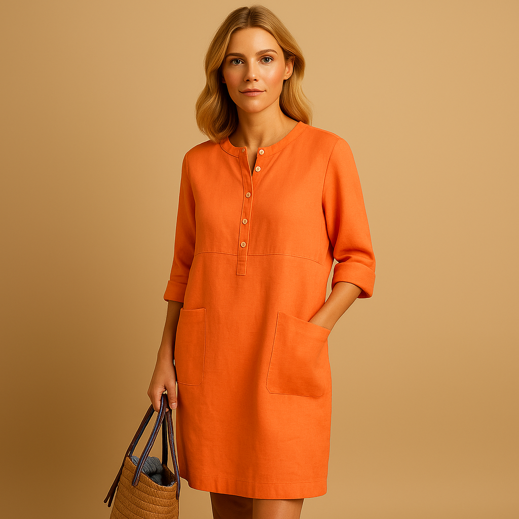 Relaxed long casual dress for women with button front, rolled sleeves, and side pockets, ideal for everyday comfort and weekend wear.