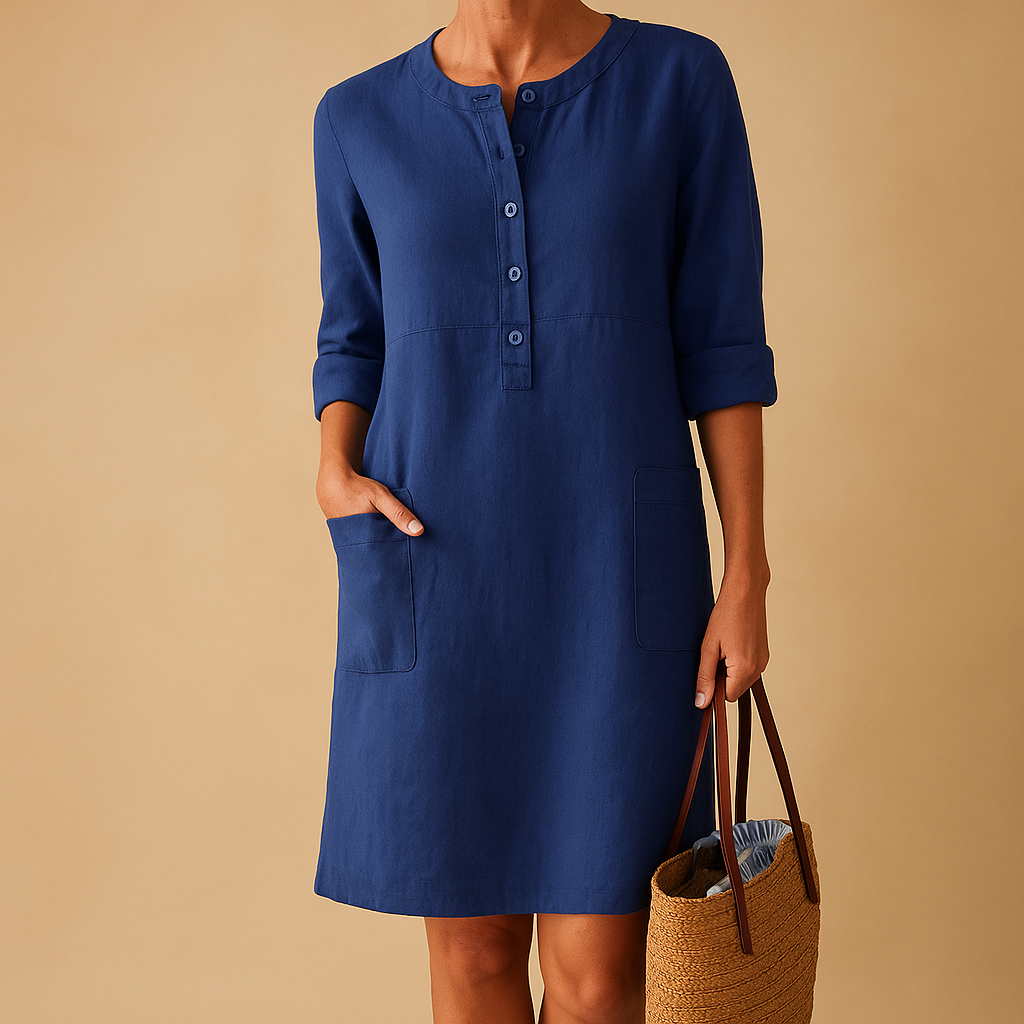 Relaxed long casual dress for women with button front, rolled sleeves, and side pockets, ideal for everyday comfort and weekend wear.