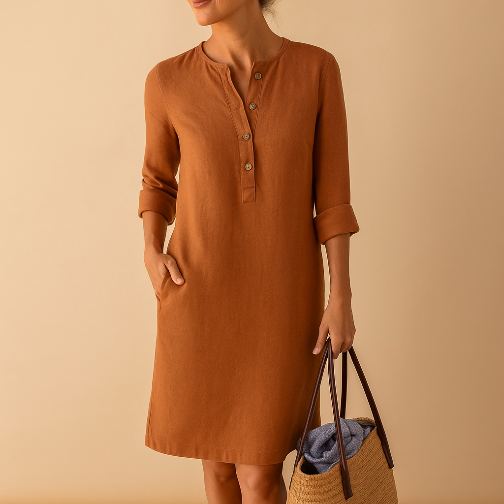 Relaxed long casual dress for women with button front, rolled sleeves, and side pockets, ideal for everyday comfort and weekend wear.