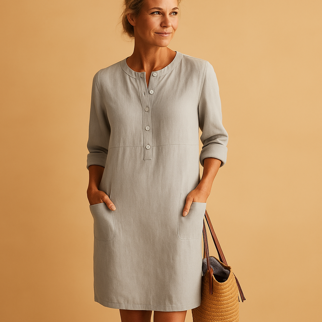 Relaxed long casual dress for women with button front, rolled sleeves, and side pockets, ideal for everyday comfort and weekend wear.