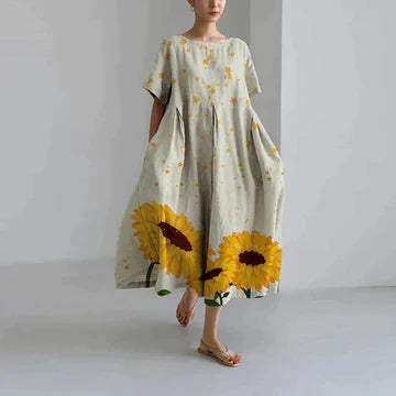 https://cdn.shopify.com/s/files/1/0741/0774/8619/files/robe-longue-beige-imprim_-tournesol.webp?v=1726495667
