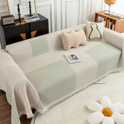 Scandinavian throw blanket with tassel edge, soft texture, cozy Nordic style, perfect for sofa decor and protection.