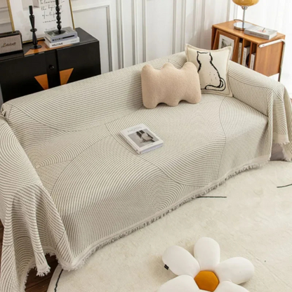 Scandinavian throw blanket with tassel edge, soft texture, cozy Nordic style, perfect for sofa decor and protection.