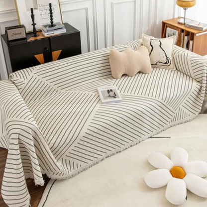 Scandinavian throw blanket with tassel edge, soft texture, cozy Nordic style, perfect for sofa decor and protection.