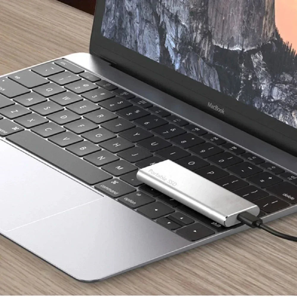 "Sleek 4TB USB-C external drive with slim metal casing, ideal for portable storage, compatible with PC and Mac."