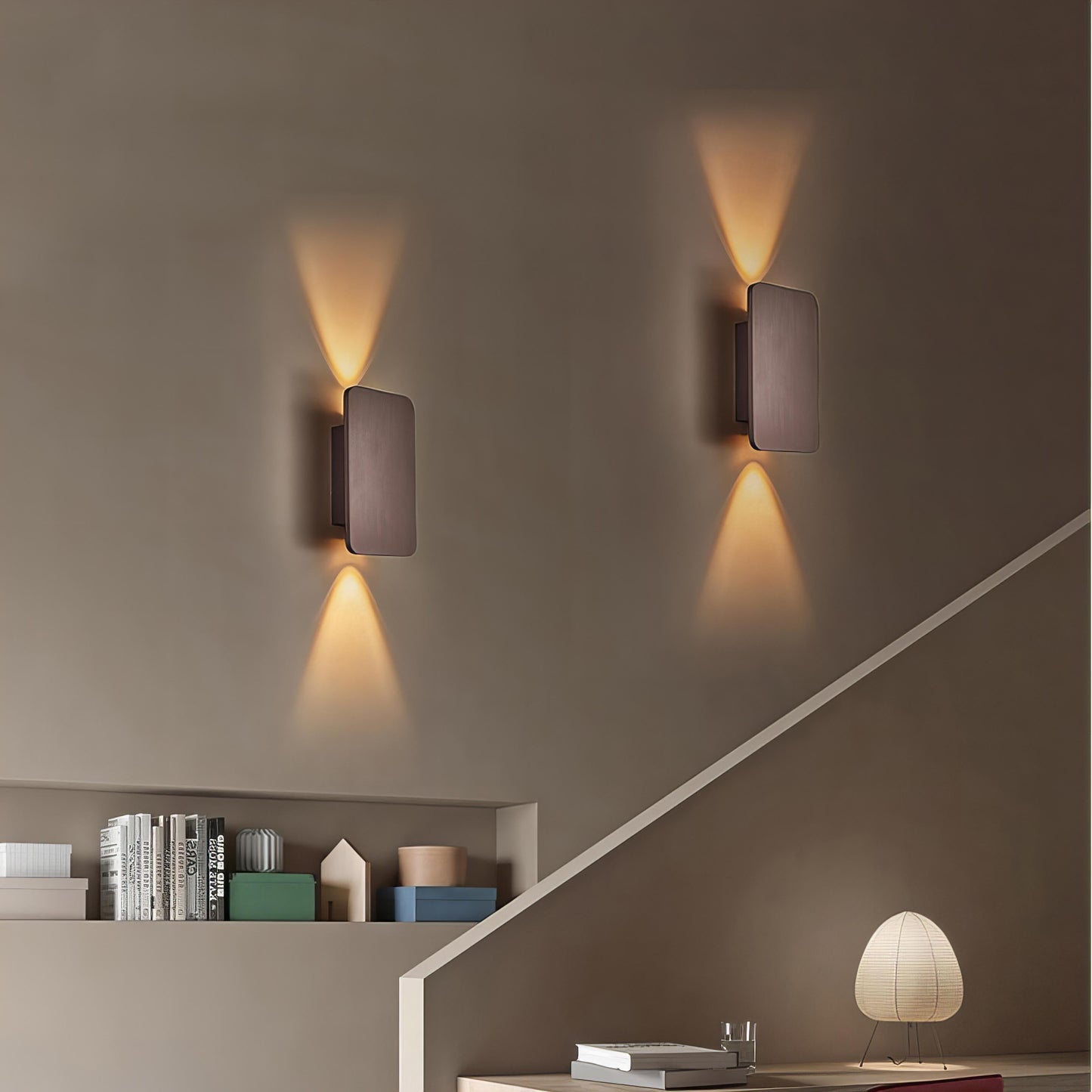 "Sleek indoor LED wall lamp with a modern rectangular design, featuring smooth finishes and warm illumination for elegant dec
