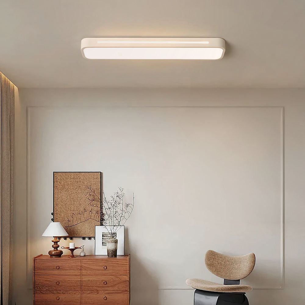 "Sleek minimalist linear LED ceiling light with iron and acrylic design, perfect for modern homes, available in three sizes."