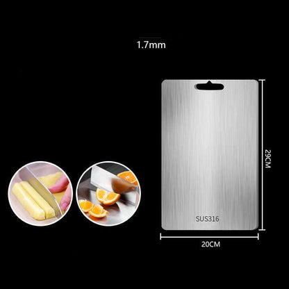 "Sleek stainless steel cutting board in use, showing durability and knife-friendly surface for kitchen prep tasks."