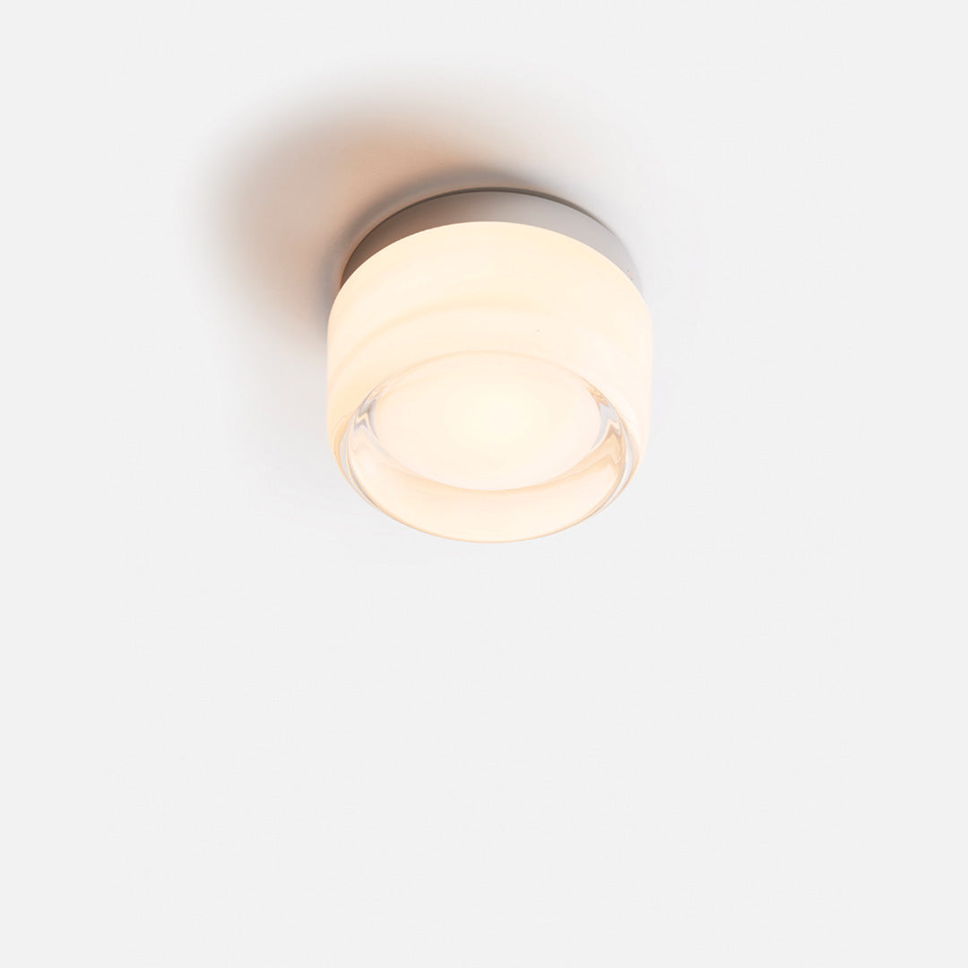 "Sleek wall mounted LED sconce light with acrylic and aluminum design, offering versatile decor enhancement for modern interi