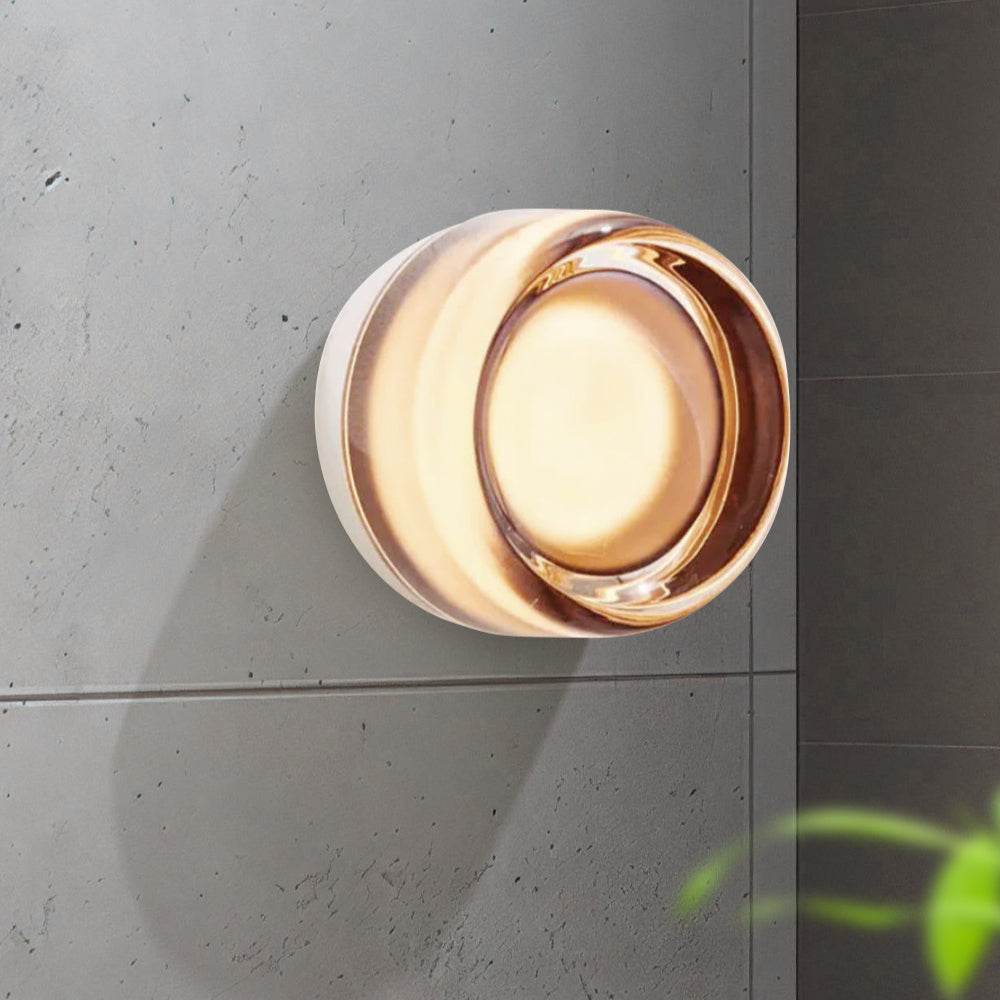 "Sleek wall mounted LED sconce light with acrylic and aluminum design, offering versatile decor enhancement for modern interi