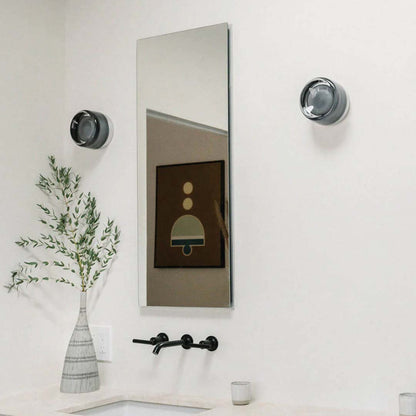 "Sleek wall mounted LED sconce light with acrylic and aluminum design, offering versatile decor enhancement for modern interi