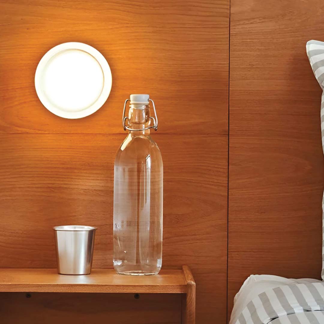 "Sleek wall mounted LED sconce light with acrylic and aluminum design, offering versatile decor enhancement for modern interi