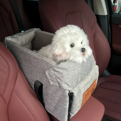 "Small Dog Cosy Car Seat Carrier Basket with padded interior, sleek design, fits securely in car for safe pet travel."