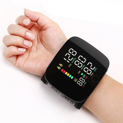 "Smart wrist blood pressure monitor with LCD, voice alerts, compact design, ideal for health & wellness monitoring."
