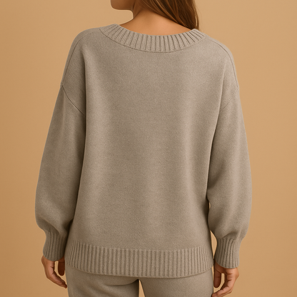 Women’s soft knit V-neck sweater with elegant slim fit, ideal for layering and everyday wear in cooler seasons