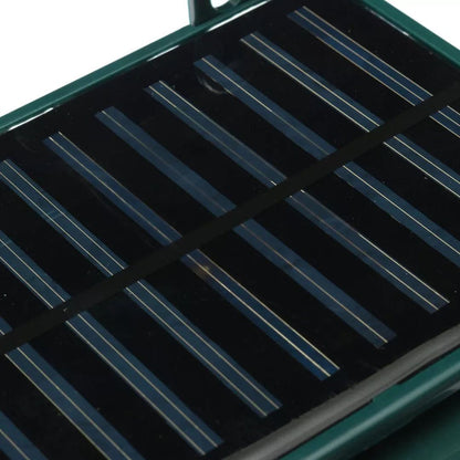 "Solar-powered motion sensor bird repeller, green and gray, for eco-friendly outdoor pest control in gardens and patios."