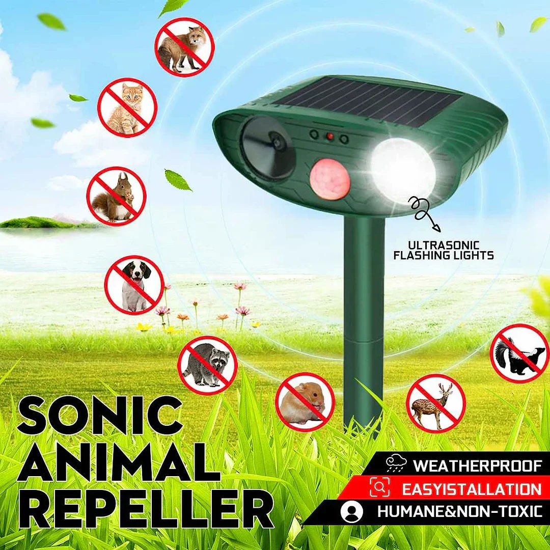 Solar-powered ultrasonic deer repeller with green casing, motion sensor, solar panel, ideal for outdoor garden protection.
