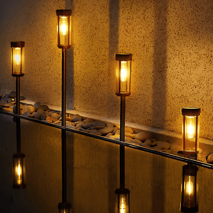 Solar-powered waterproof garden torch with flickering glow, decorative design, illuminating gardens, patios, and pathways.