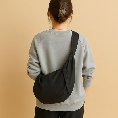 Spacious puffer crossbody bag for women with water-resistant finish, thick shoulder strap, and roomy interior—ideal for travel and everyday use.
