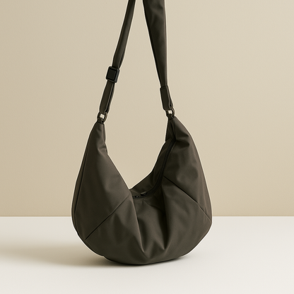 Spacious puffer crossbody bag for women with water-resistant finish, thick shoulder strap, and roomy interior—ideal for travel and everyday use.