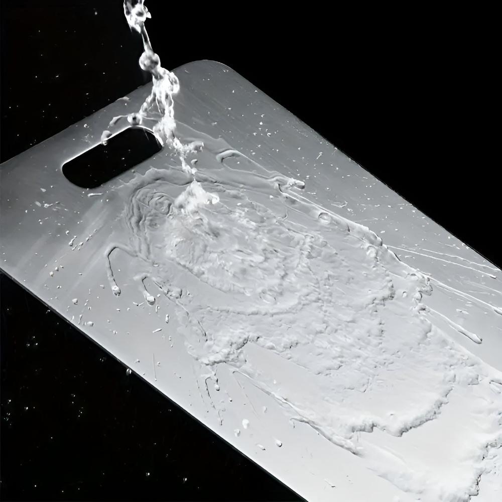 "Stainless steel cutting board, non-slip, scratch-resistant surface for hygienic food prep, sleek design for kitchen use."
