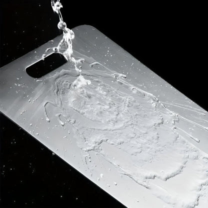 "Stainless steel cutting board, non-slip, scratch-resistant surface for hygienic food prep, sleek design for kitchen use."
