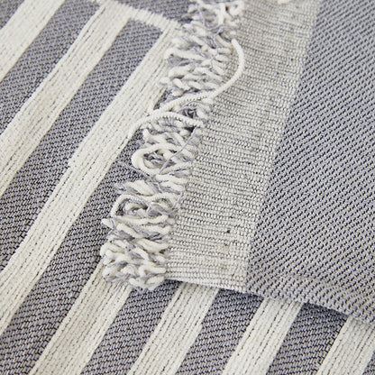 "Striped sofa throw cover, durable stretchable fabric, minimalist pattern, elevates living space, protects against spills."