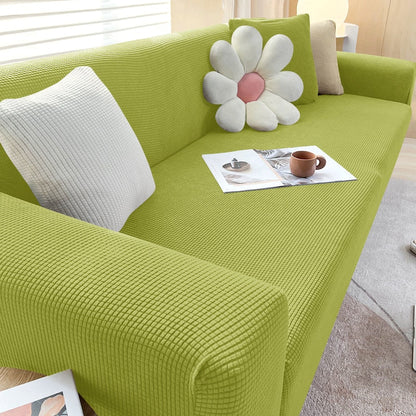 "Textured stretch sofa cover in beige, snug fit for sofas, non-slip, adds elegance, protects against spills and wear."