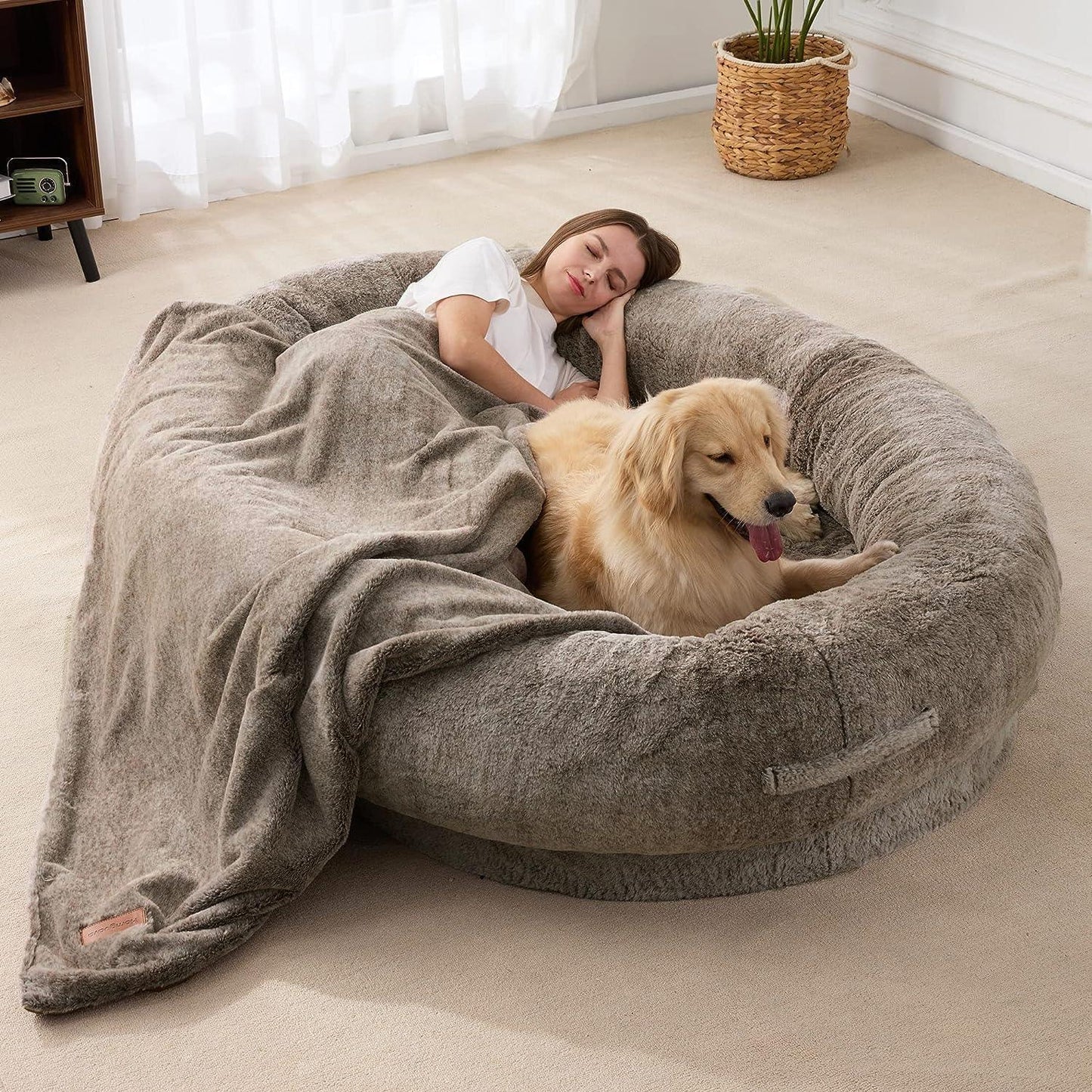 "Ultra-comfy plush lounger for pets and humans, oversized with plush pillow bolsters, dual-layer memory foam, stylish design.