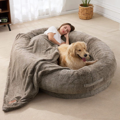 "Ultra-comfy plush lounger for pets and humans, oversized with plush pillow bolsters, dual-layer memory foam, stylish design.