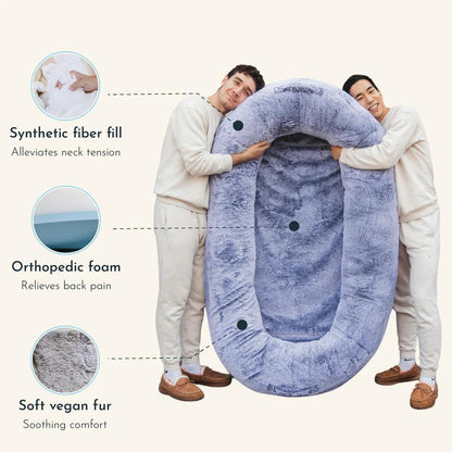 "Ultra-comfy plush lounger for pets and humans, oversized with plush pillow bolsters, dual-layer memory foam, stylish design.