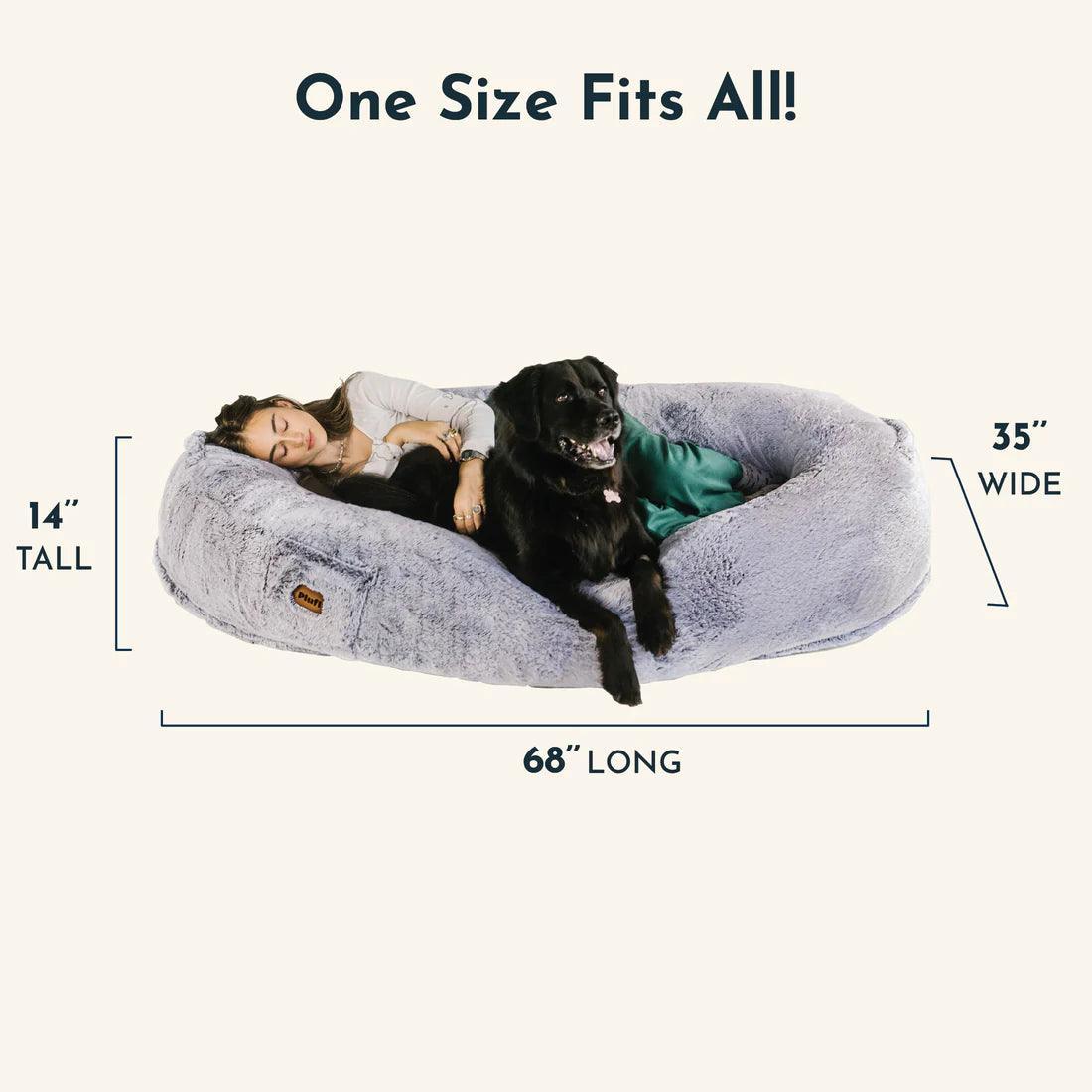 "Ultra-comfy plush lounger for pets and humans, oversized with plush pillow bolsters, dual-layer memory foam, stylish design.