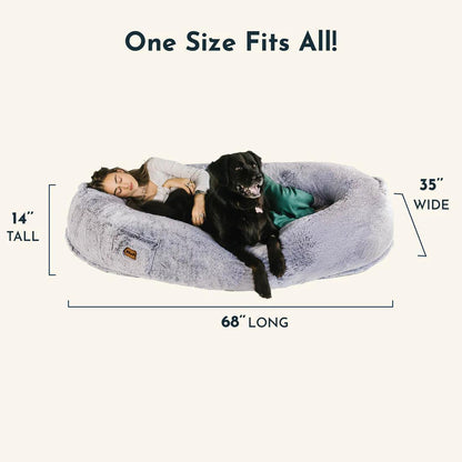 "Ultra-comfy plush lounger for pets and humans, oversized with plush pillow bolsters, dual-layer memory foam, stylish design.