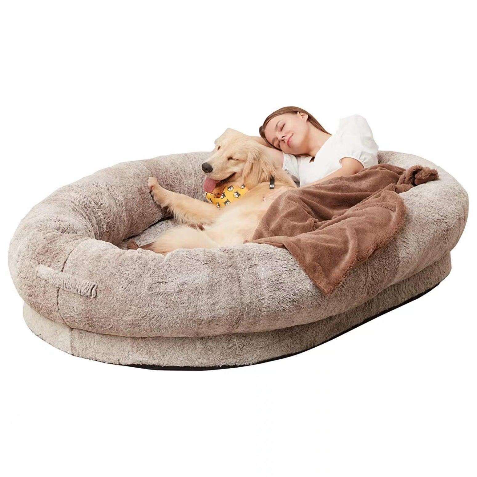 "Ultra-comfy plush lounger for pets and humans, oversized with plush pillow bolsters, dual-layer memory foam, stylish design.