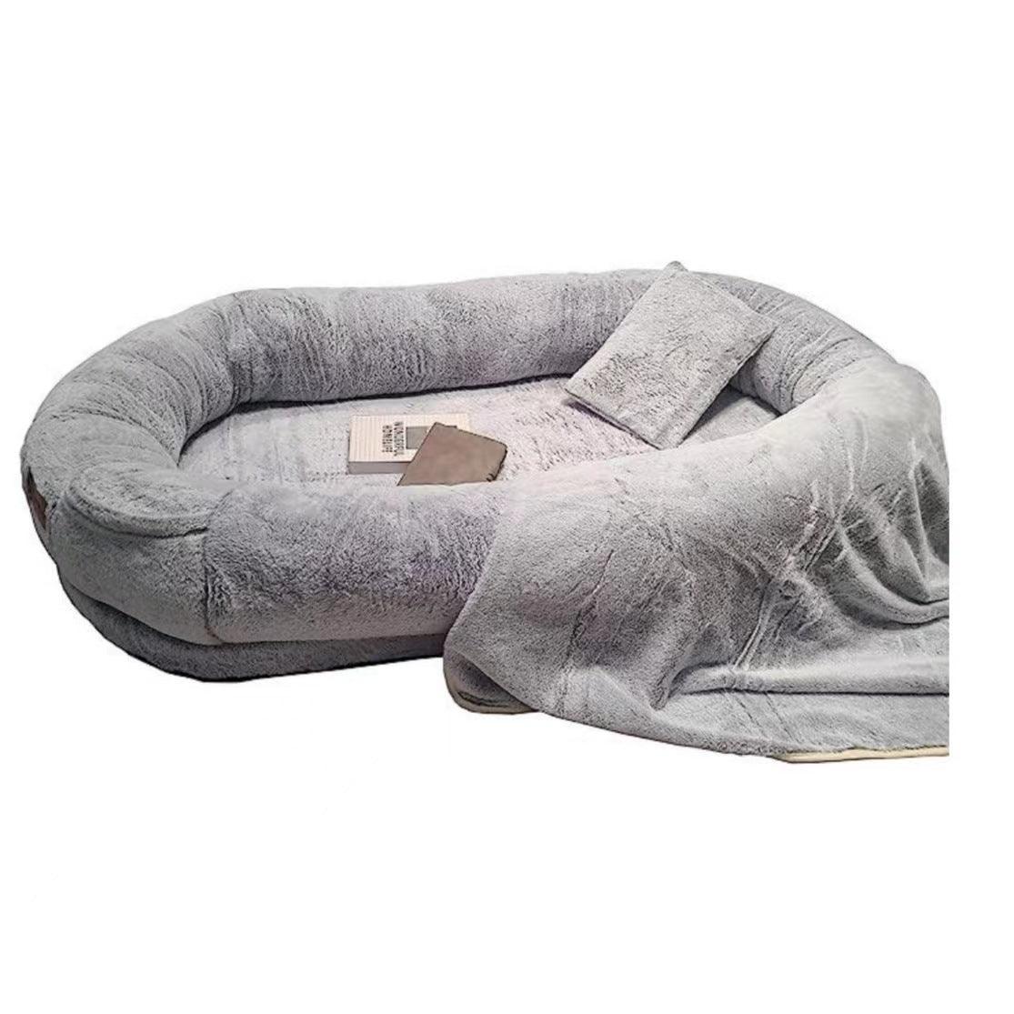 "Ultra-comfy plush lounger for pets and humans, oversized with plush pillow bolsters, dual-layer memory foam, stylish design.
