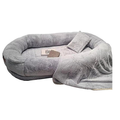 "Ultra-comfy plush lounger for pets and humans, oversized with plush pillow bolsters, dual-layer memory foam, stylish design.